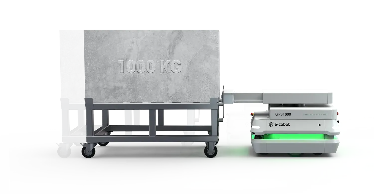 GRB1000 tractant un chariot de production de 1000 kg en environnement industriel